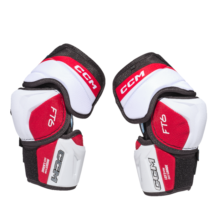 white elbow pads with red details and black lining