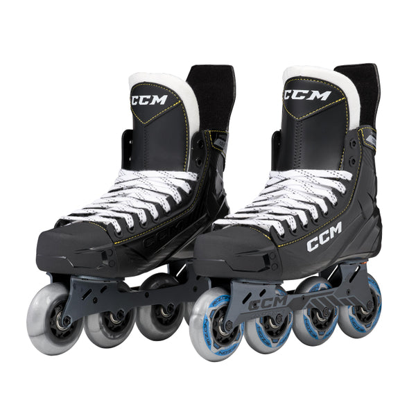 Black inline skates with yellow trim and blue wheels