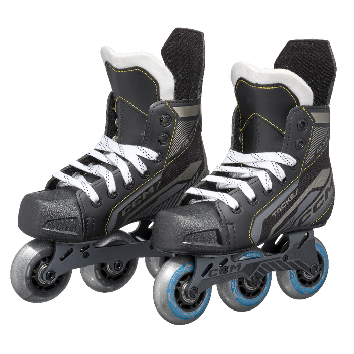 black roller skates with yellow stitching 