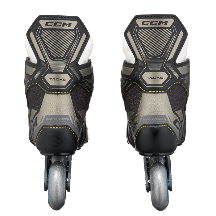 black roller skates with yellow stitching 