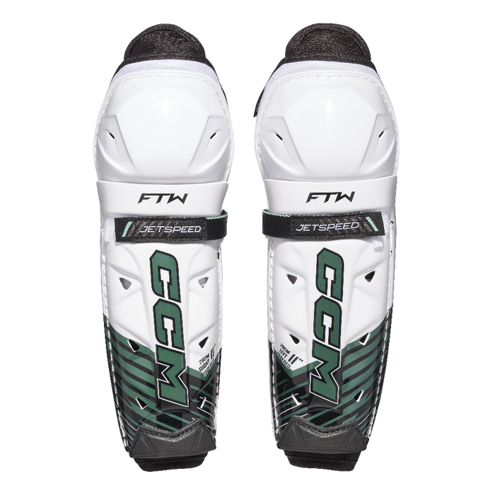 White and green shin guards