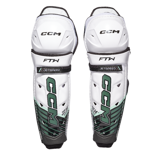 white and green shin guards