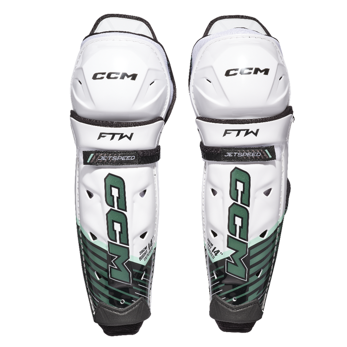 white and green shin guards