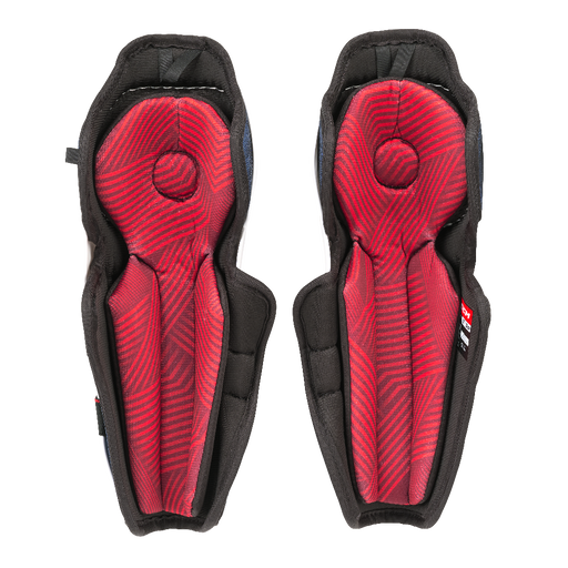 white shin guards with blue details and red padding