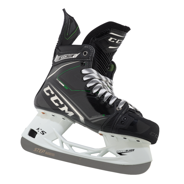 Black skates, with small green features. White laces and black lining