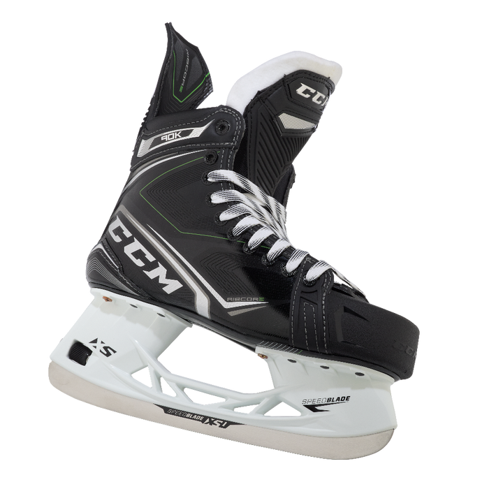 Black skates, with small green features. White laces and black lining