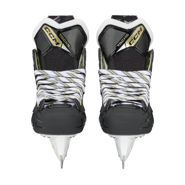 Black skates with gold accents, white laces and black lining