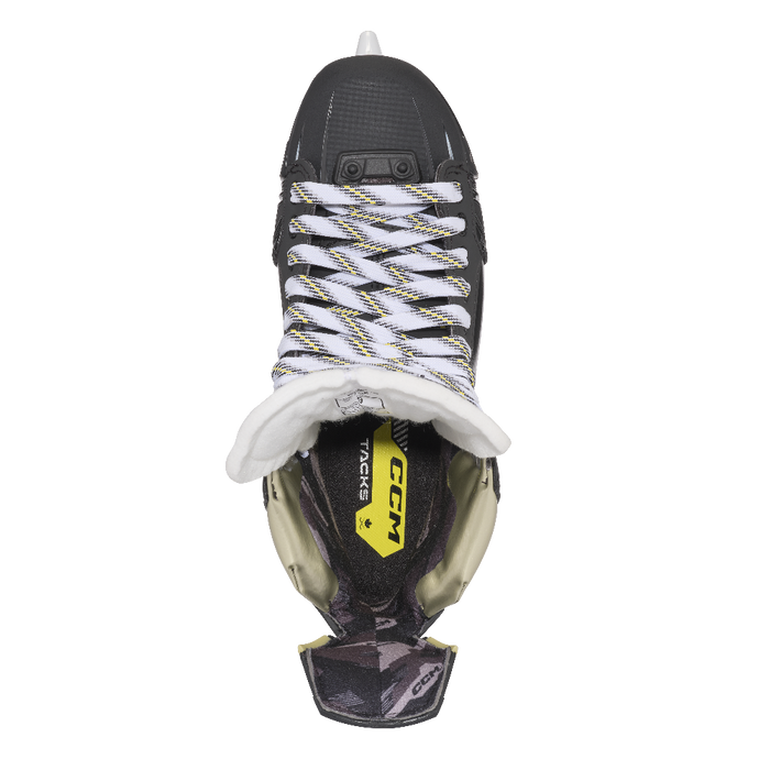 Black skates with gold accents, white laces and black lining