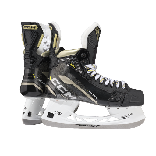 Black skates with gold accents, white laces and black lining