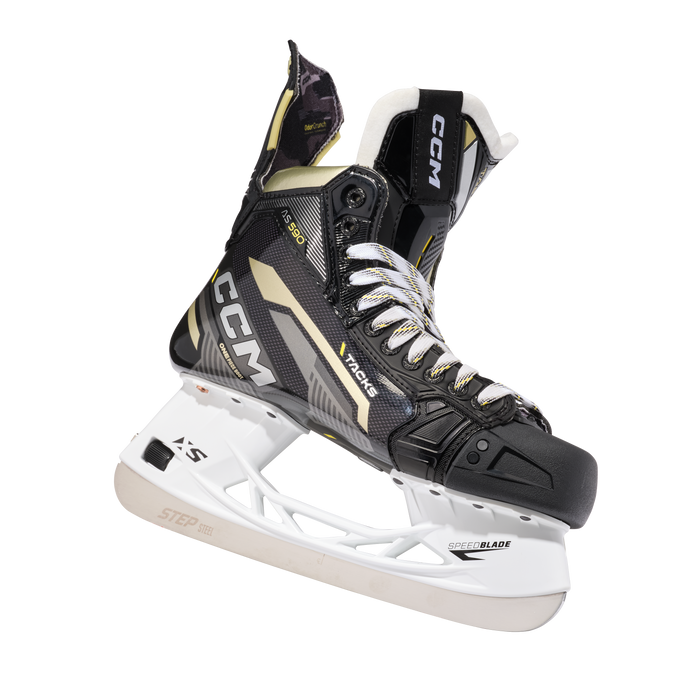 Black skates with gold accents, white laces and black lining