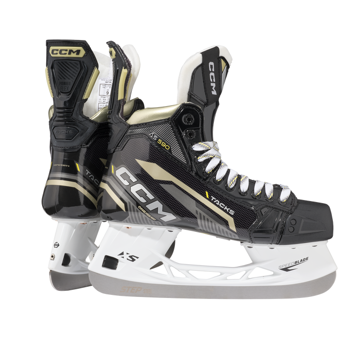 Black skates with gold accents, white laces and black lining