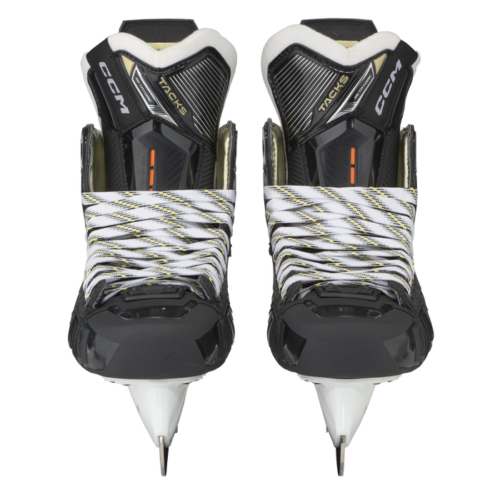 Black skates with gold accents, white laces and black lining