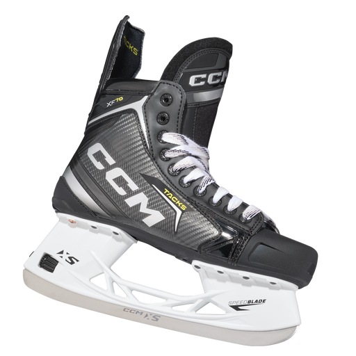 Black skates with gold accents, white laces and black lining