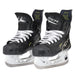 Black skates with gold accents, white laces and black lining
