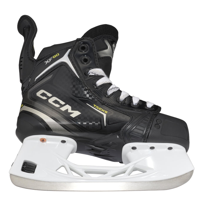 Black skates with gold accents, white laces and black lining
