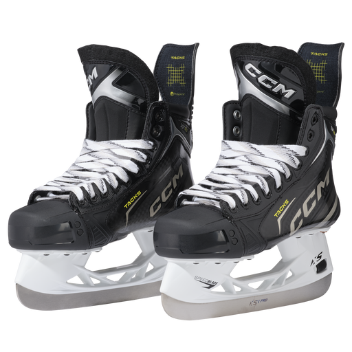 Black skates with gold accents, white laces and black lining
