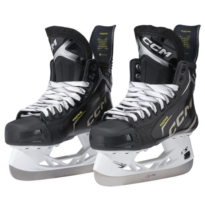 Black skates with gold accents, white laces and black lining