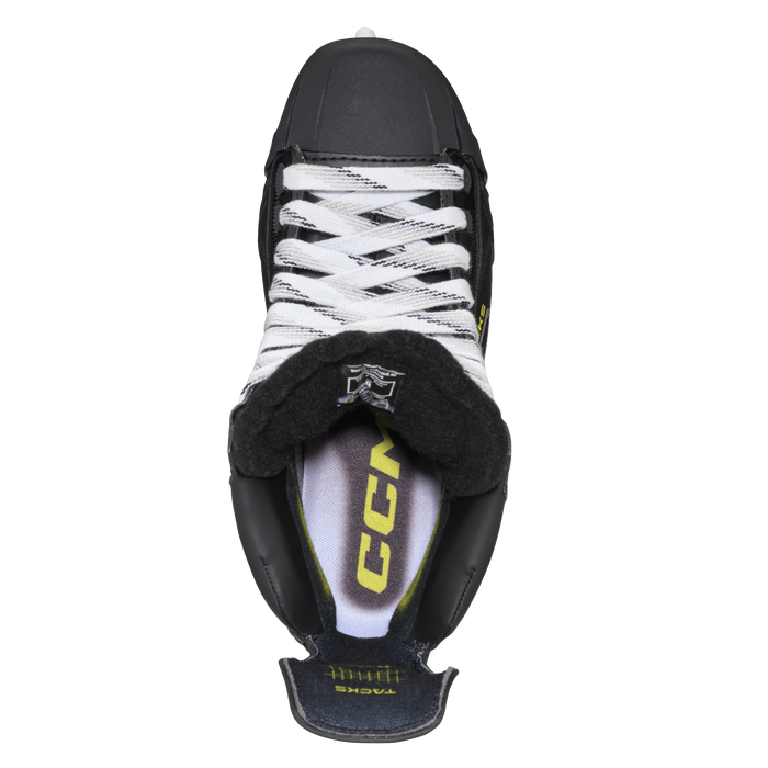 Black skates with gold accents, white laces and black lining