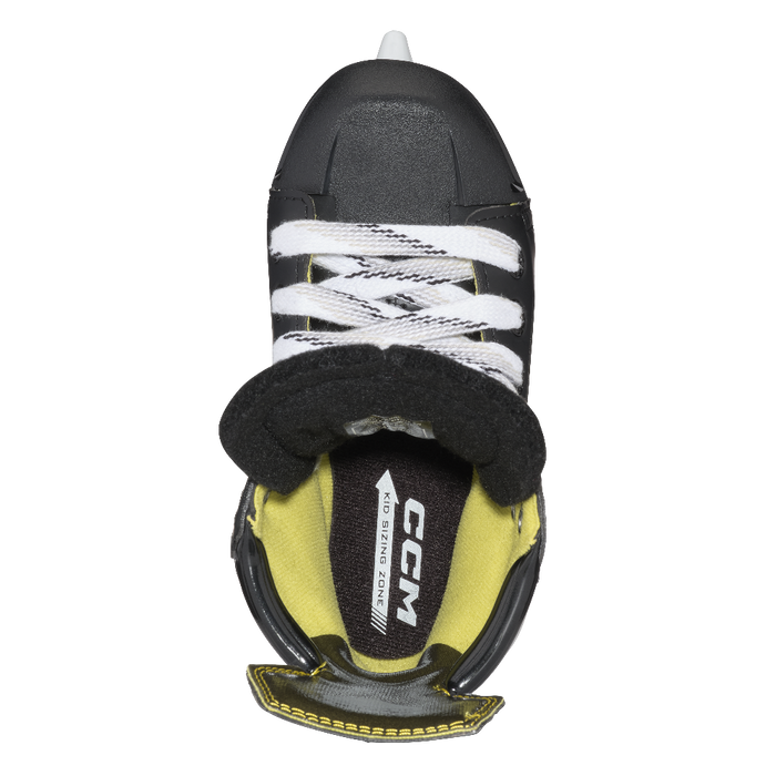 Inside of one black skate, with yellow lining