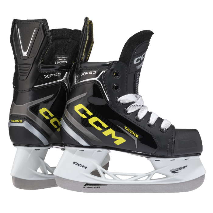 Two black skates, with yellow CCM