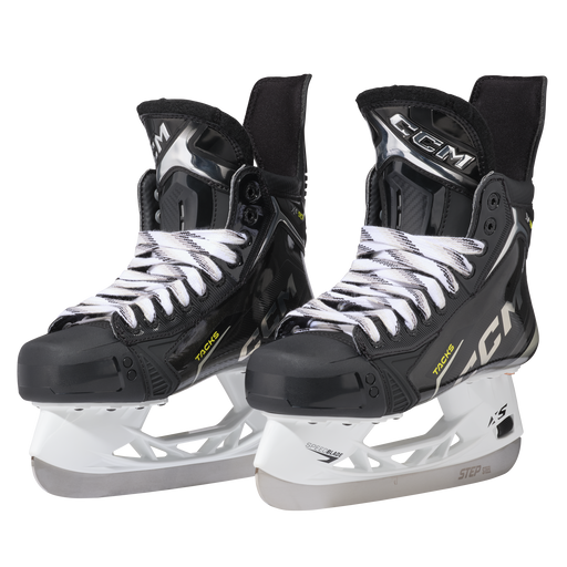 Black skates with gold accents, white laces and black lining