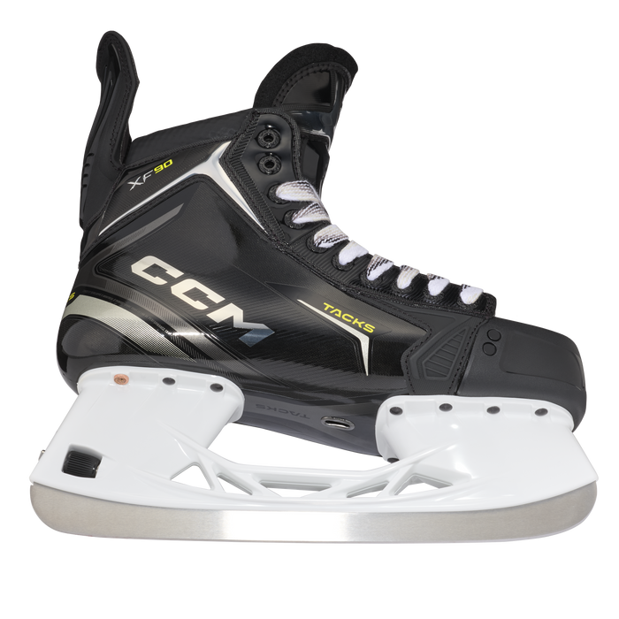 Black skates with gold accents, white laces and black lining