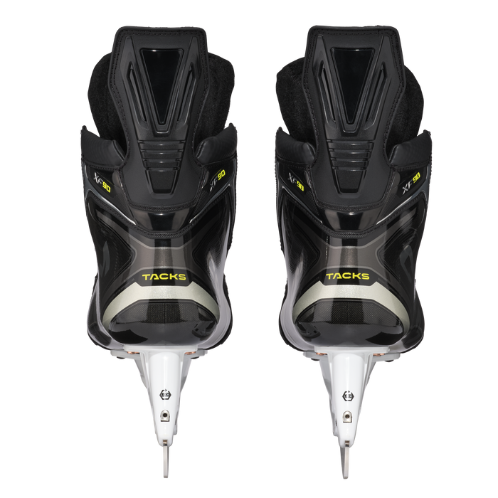 Black skates with gold accents, white laces and black lining