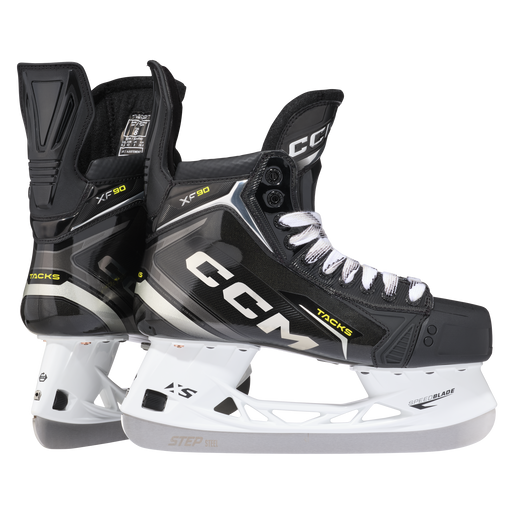 Black skates with gold accents, white laces and black lining