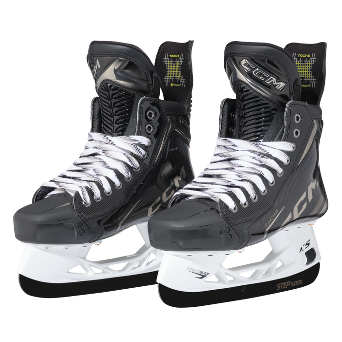 Black skates with gold accents, white laces and black lining