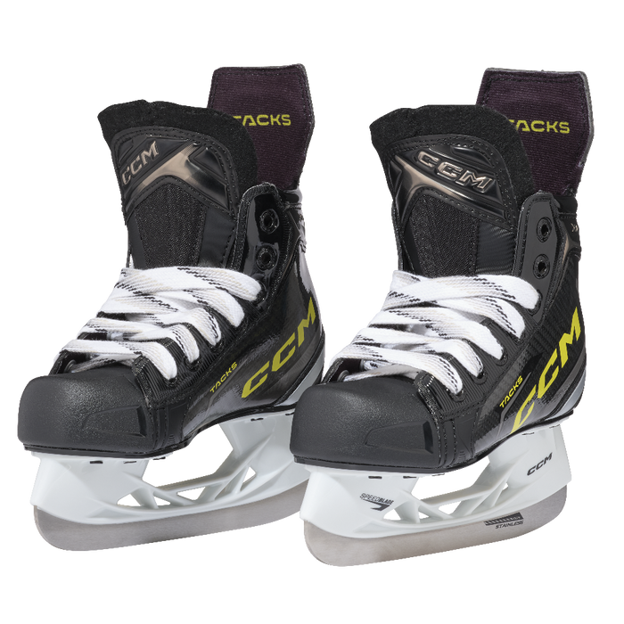 Two black skates, with yellow CCM