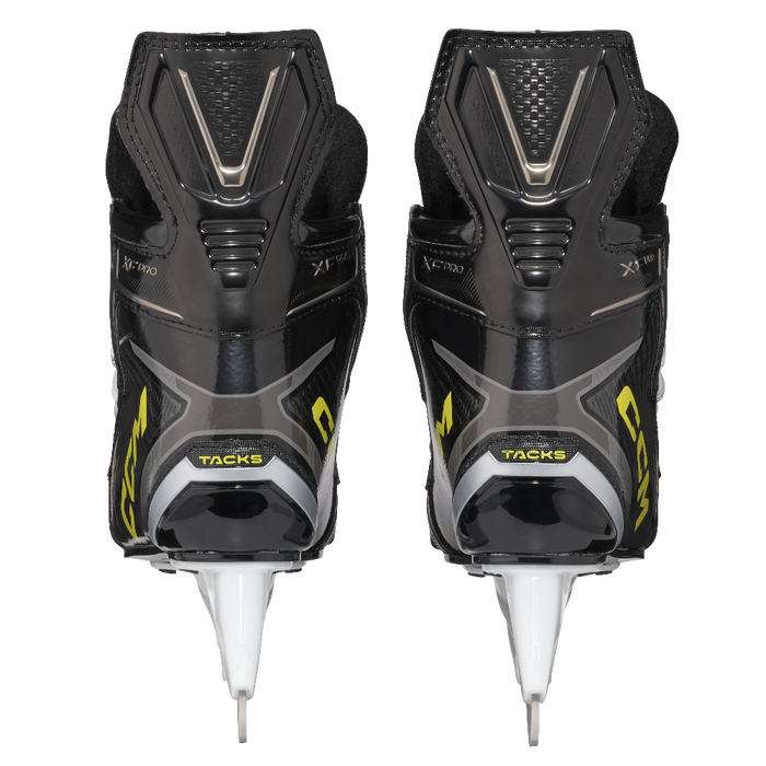 Two black skates, with yellow CCM
