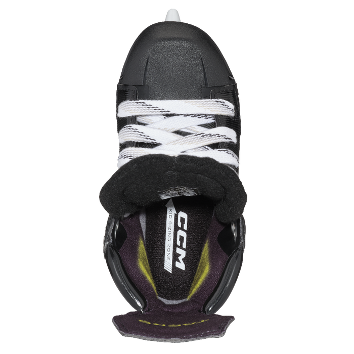 Inside of one black skate, with black and yellow lining