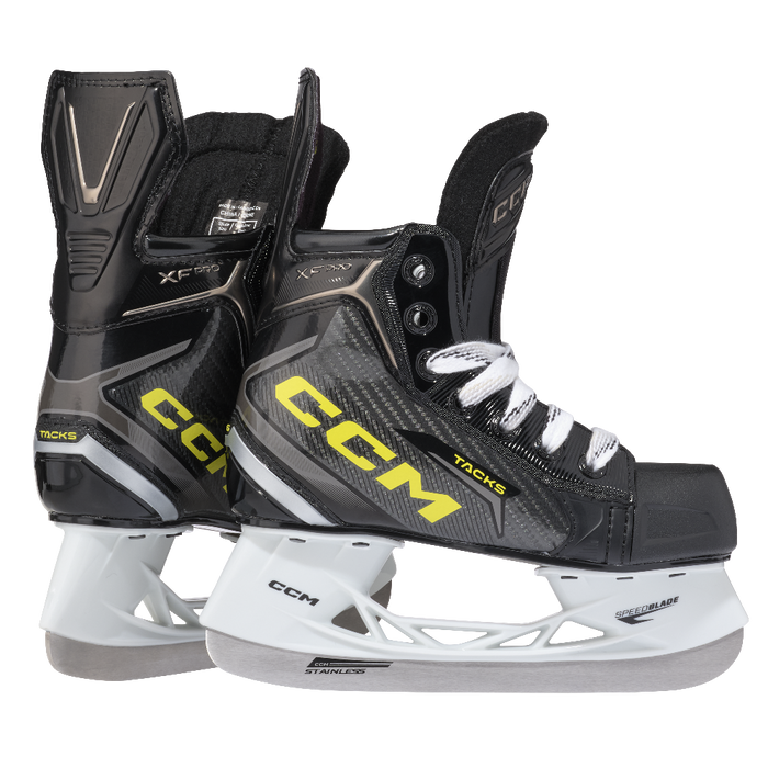 Two black skates, with yellow CCM