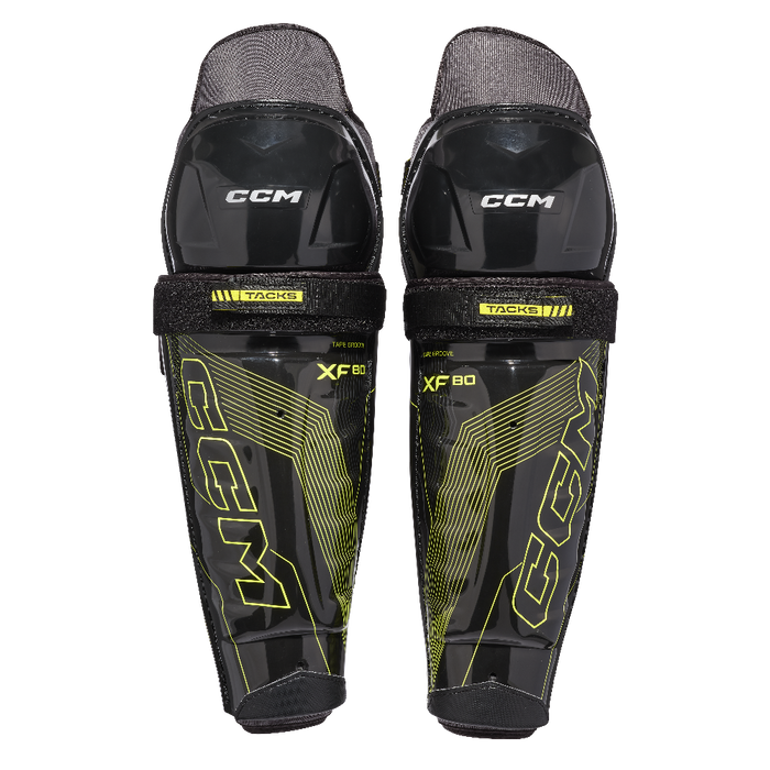 Black and yellow ccm shin guard junior