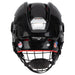 black helmet with red padding and black cage