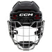black helmet with red padding and silver cage