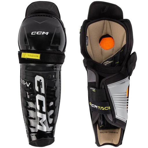 Black shin guards with brown and orange lining