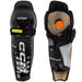 Black shin guards with brown and orange lining