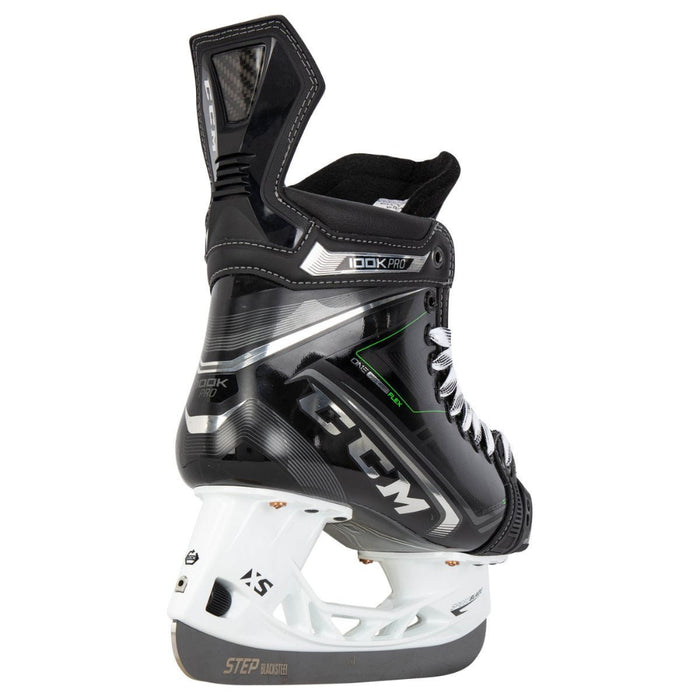 Black skates, with small green features. White laces and black lining