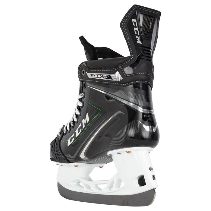 Black skates, with small green features. White laces and black lining