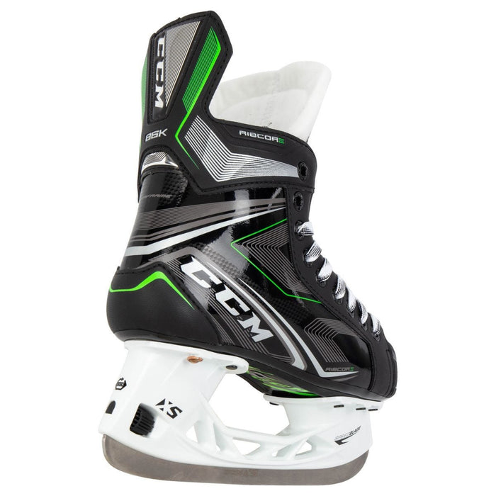 Black skates with green features. White laces. 