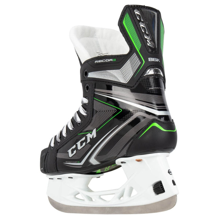 Black skates with green features. White laces. 