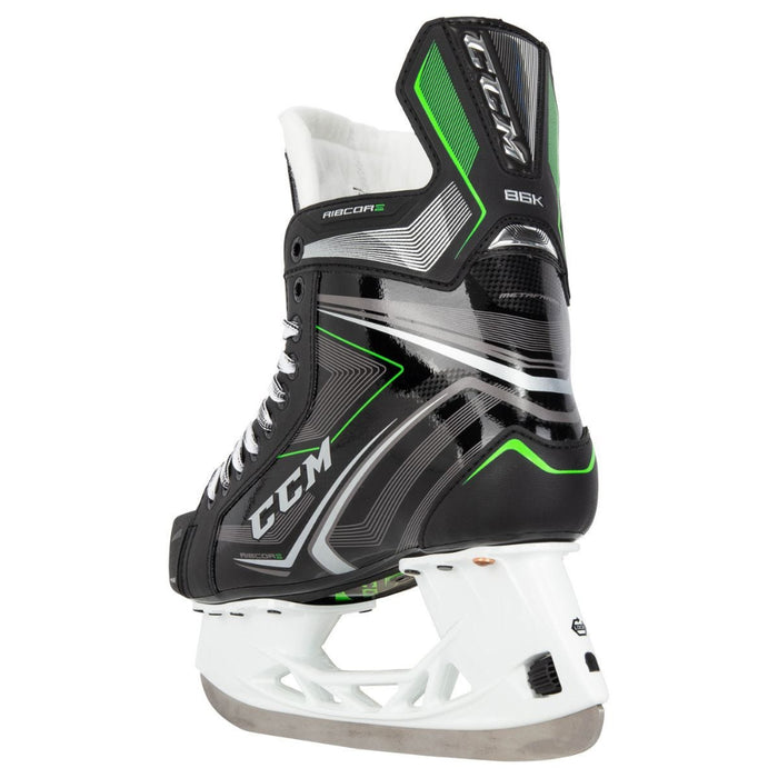 Black skates with green features. White laces. 
