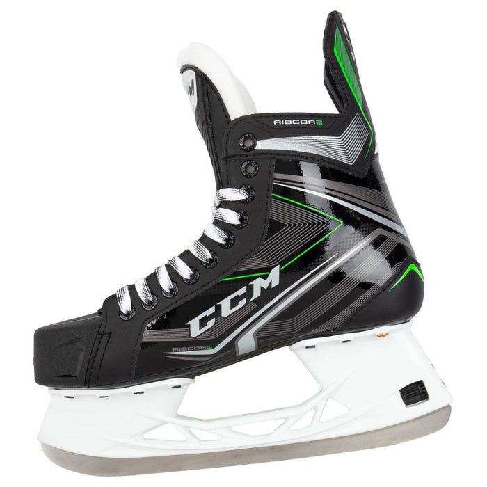 Black skates with green features. White laces. 