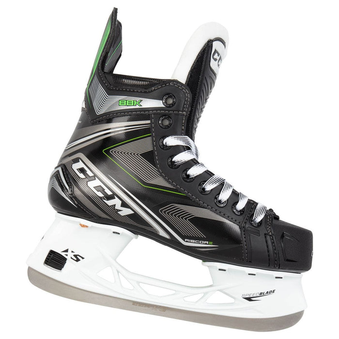 Black skates, with small green features. White laces and black lining