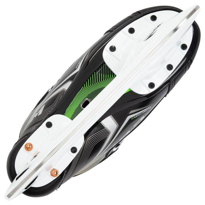 Black skates, with small green features. White laces and black lining