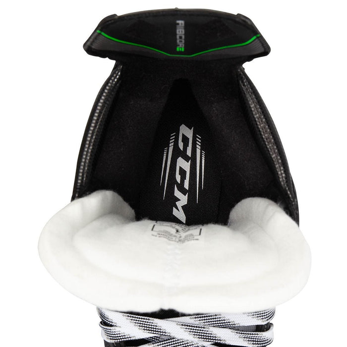 Black skates, with small green features. White laces and black lining