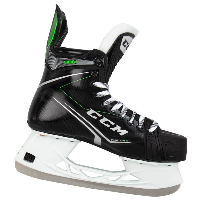 Black skates, with small green features. White laces and black lining