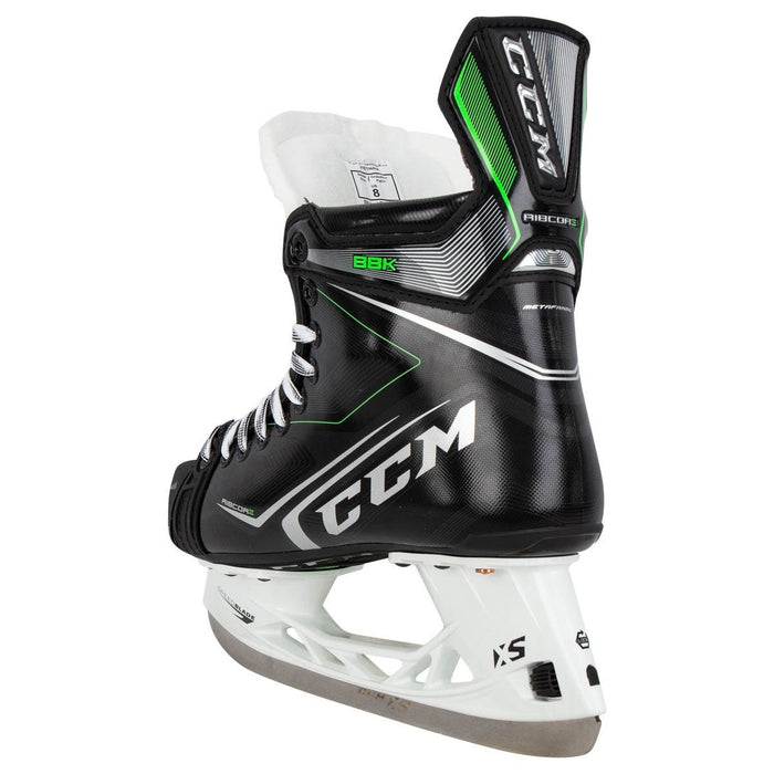 Black skates, with small green features. White laces and black lining