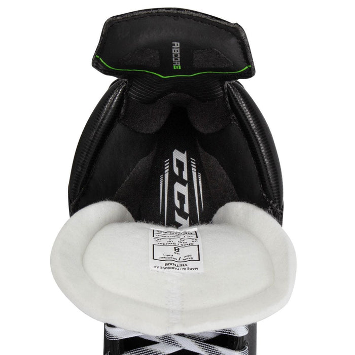 Black skates, with small green features. White laces and black lining